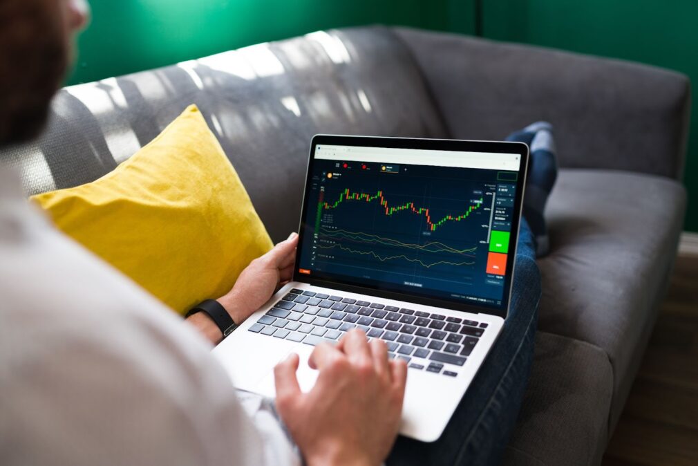 Man checking the stock market on the laptop