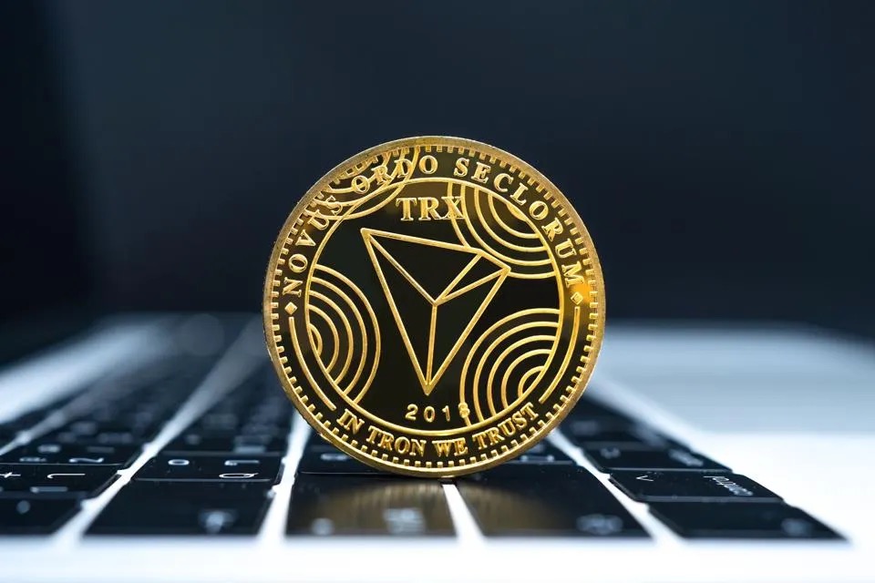 Throne coin on laptop keyboard