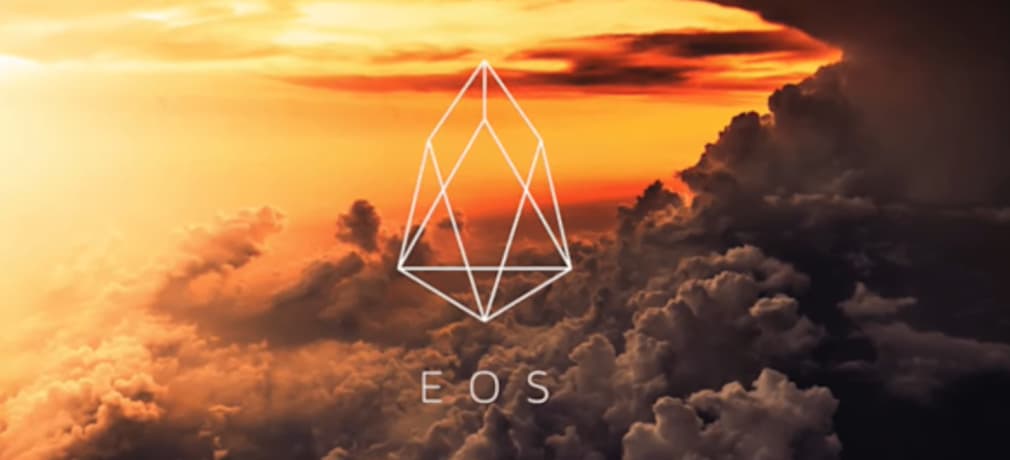 The EOS logo set against a backdrop of a dramatic cloudy sky at sunset